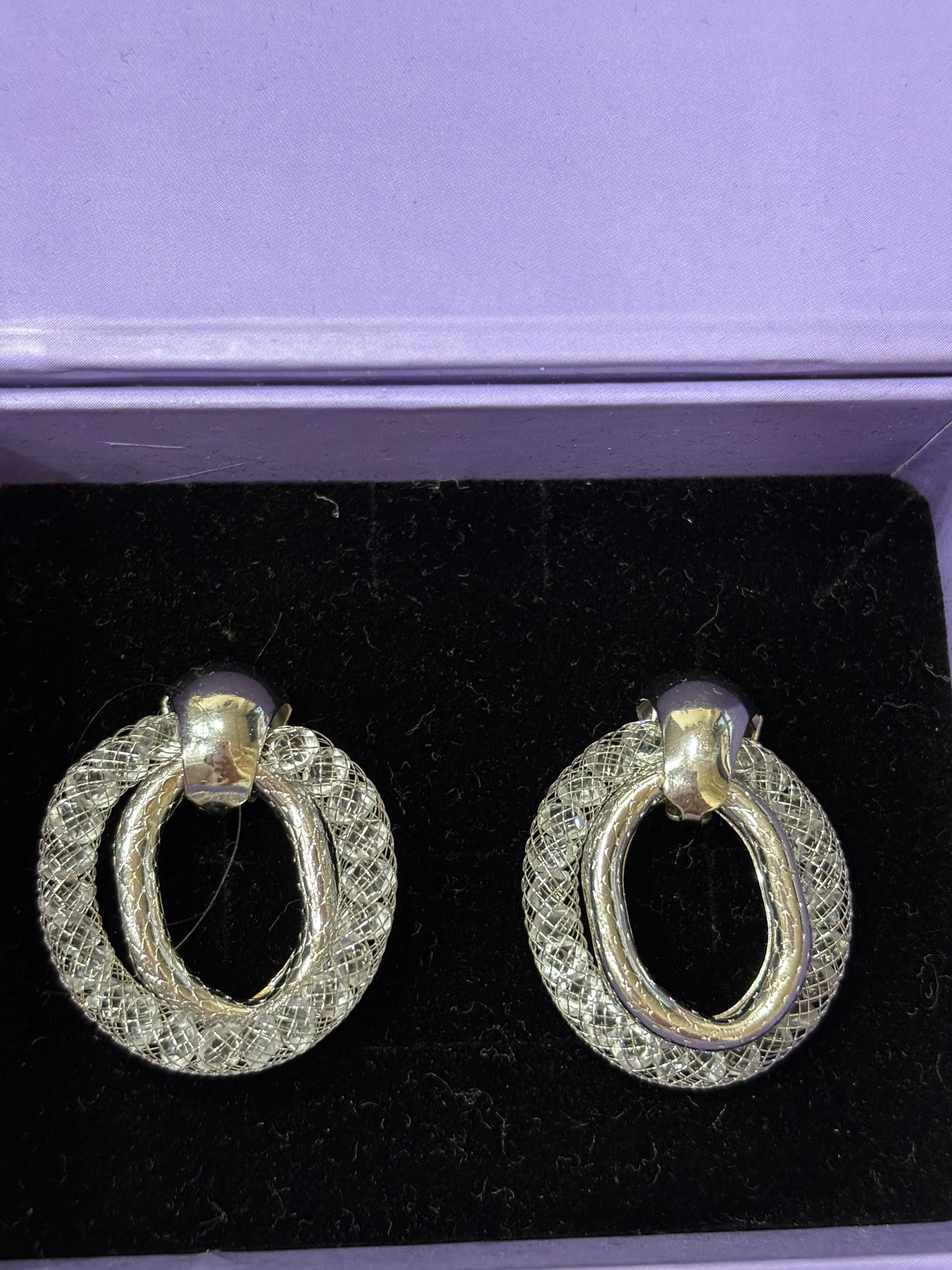 Stylish silver twisted design baala shaped earrings