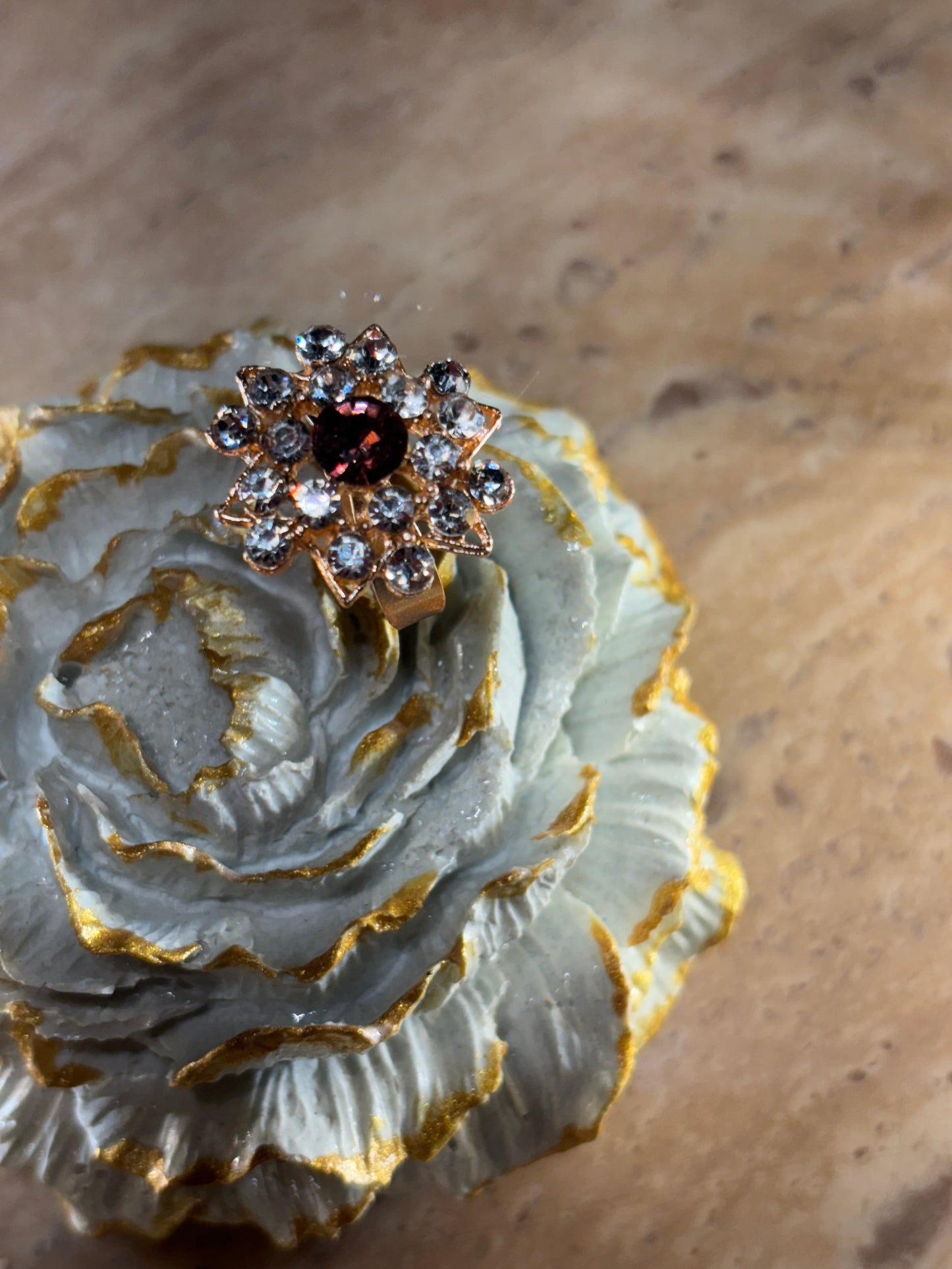 STONE RING IN BROWN COLOUR .