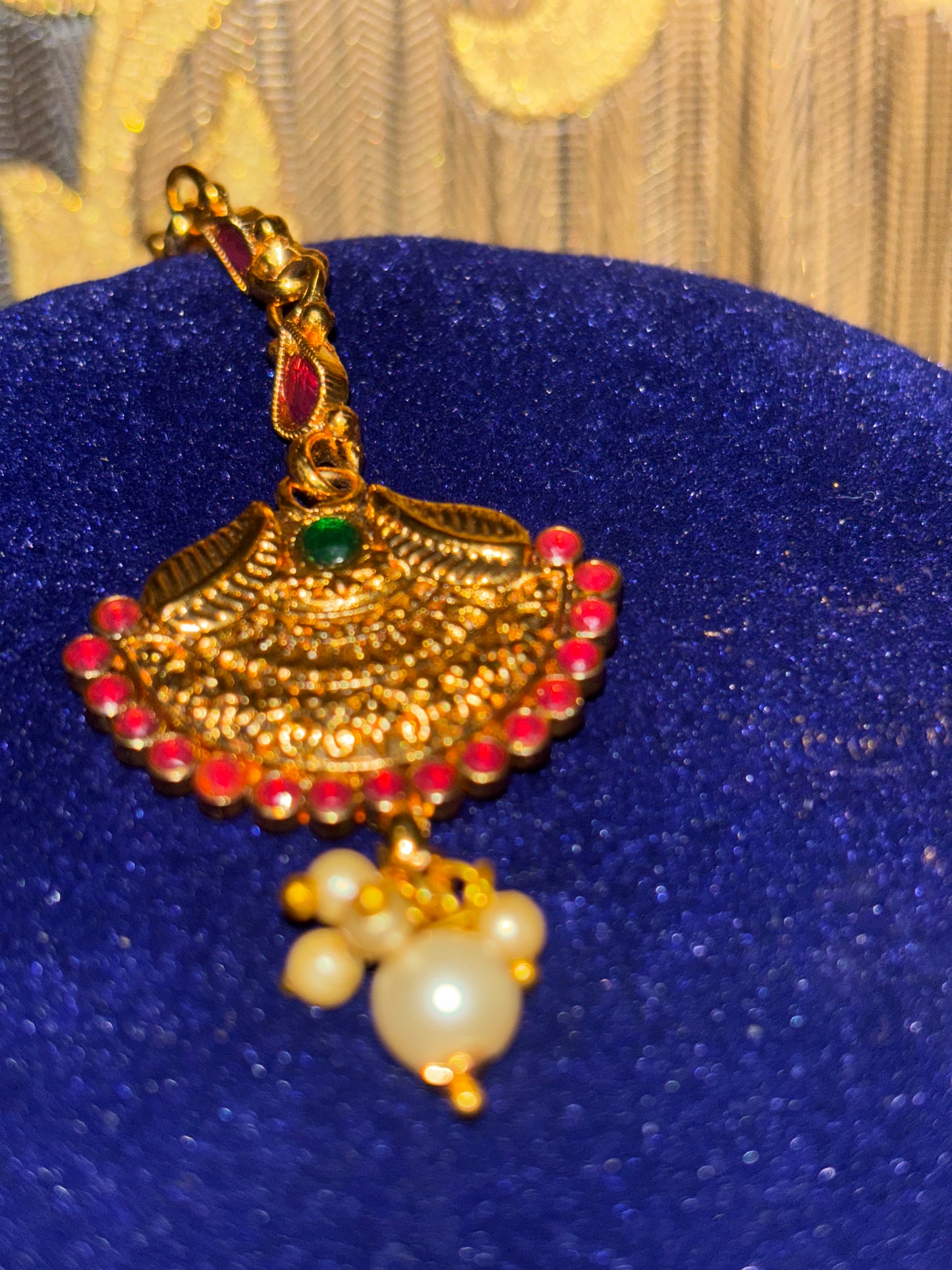 traditional haar design with red beads