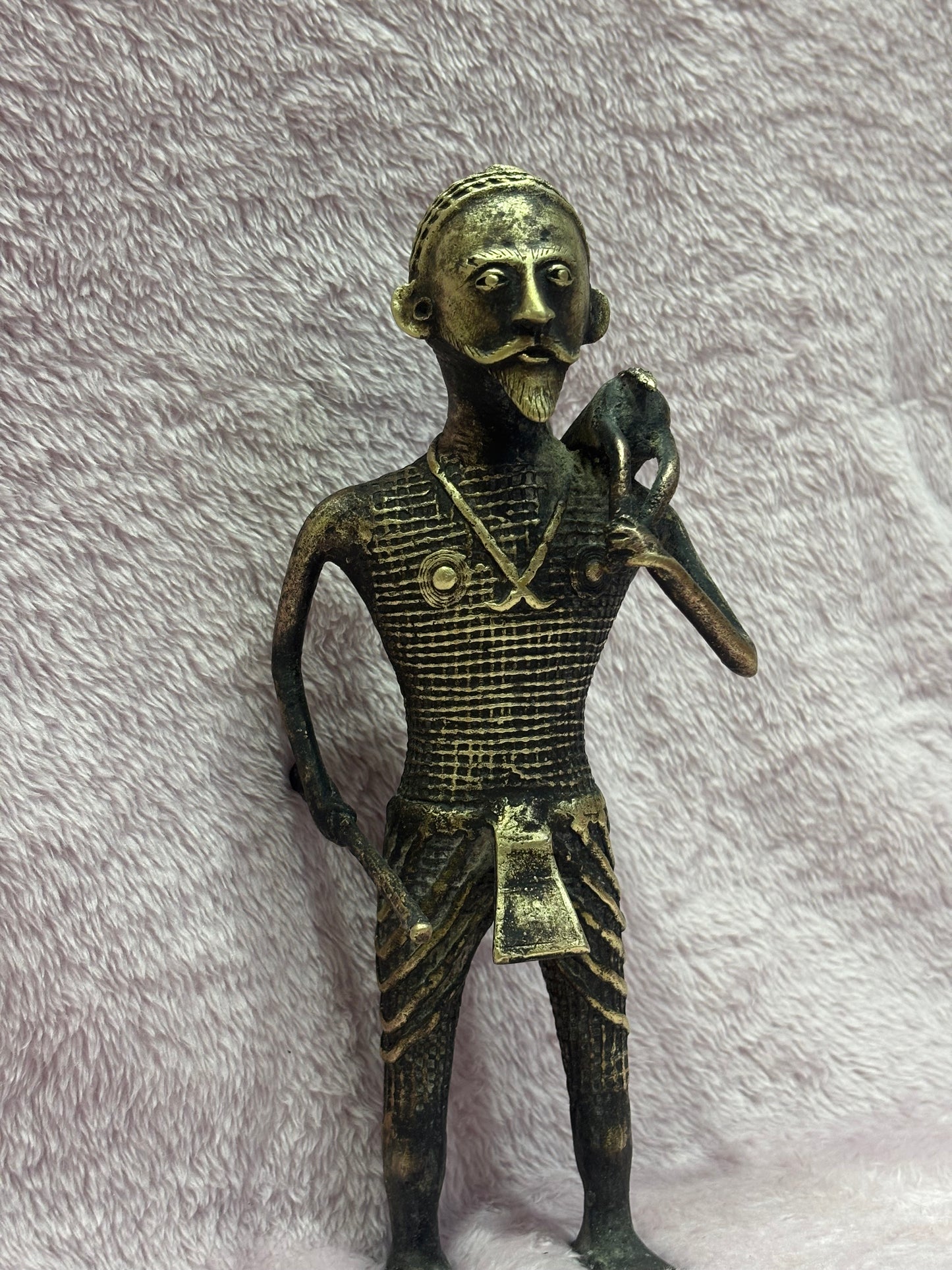 Z .ANTIQUE FORM STATUE OF A MAN WITH SWAMP DEER