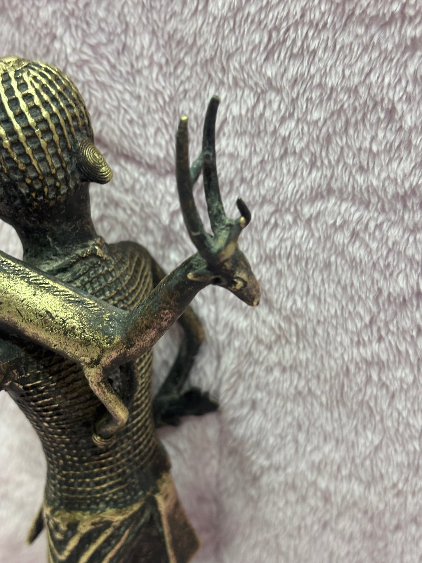 Z .ANTIQUE FORM STATUE OF A MAN WITH SWAMP DEER