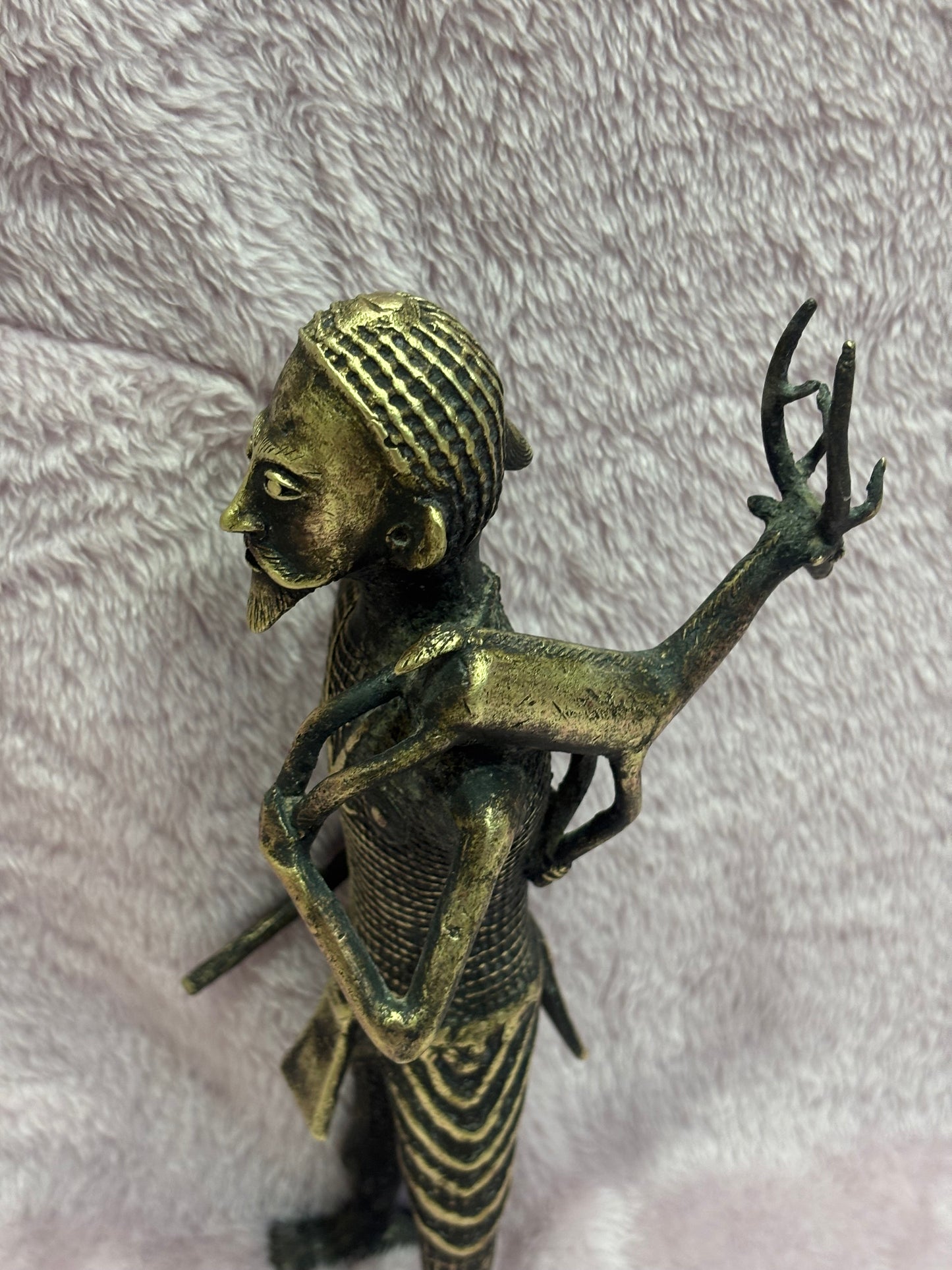 Z .ANTIQUE FORM STATUE OF A MAN WITH SWAMP DEER