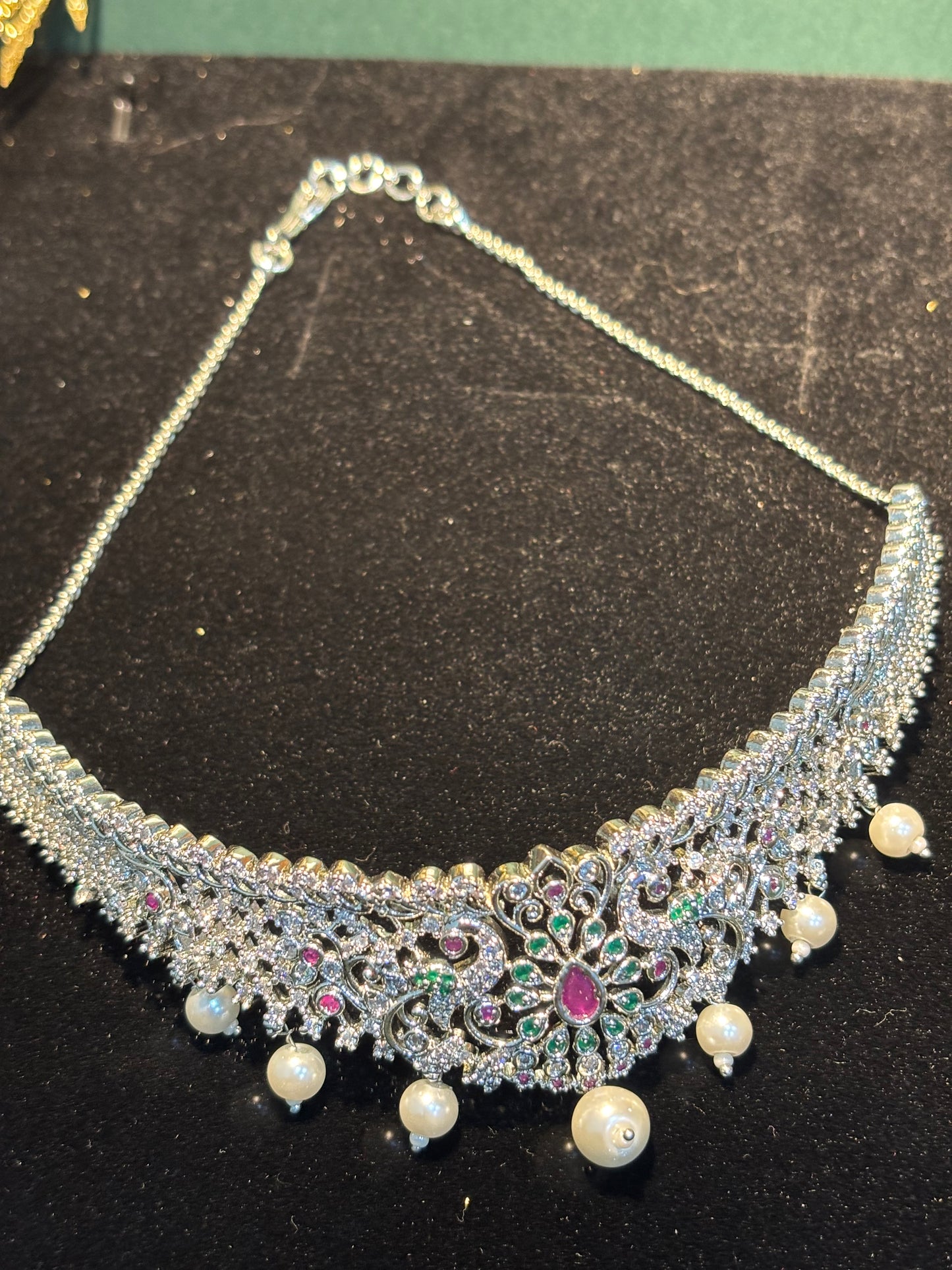 RADIANT AD CHOKER SET IN SIVER COLOUR WITH MULTICOLOR DESIGN .