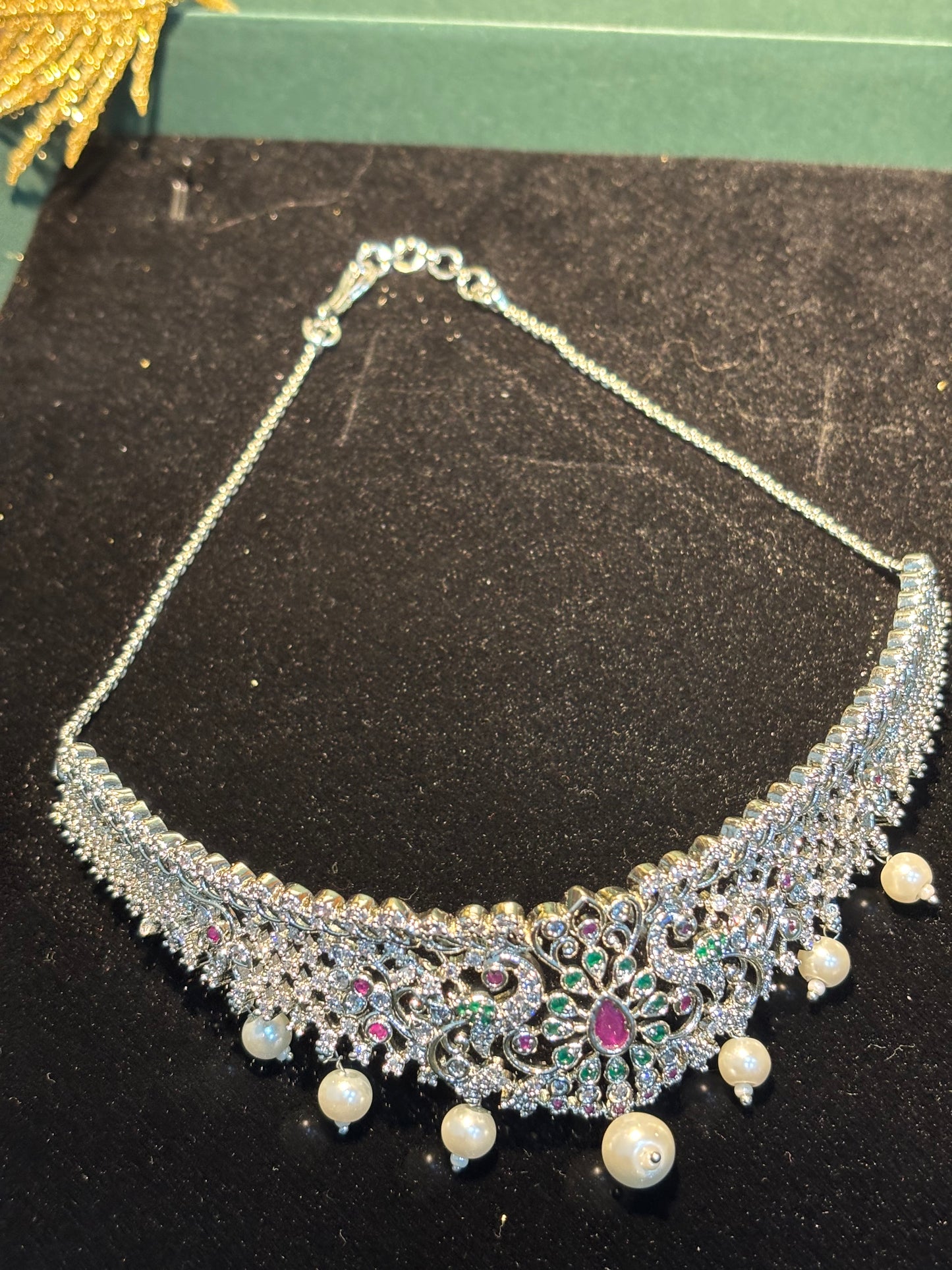 RADIANT AD CHOKER SET IN SIVER COLOUR WITH MULTICOLOR DESIGN .