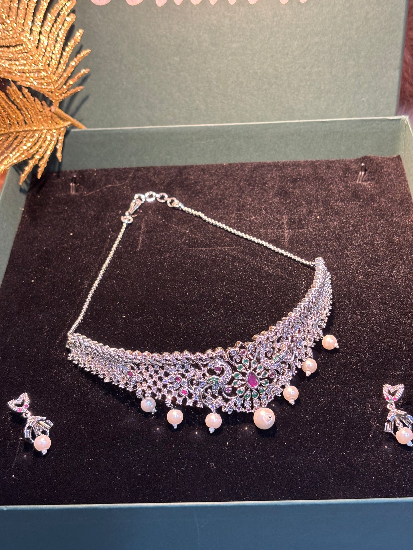 RADIANT AD CHOKER SET IN SIVER COLOUR WITH MULTICOLOR DESIGN .