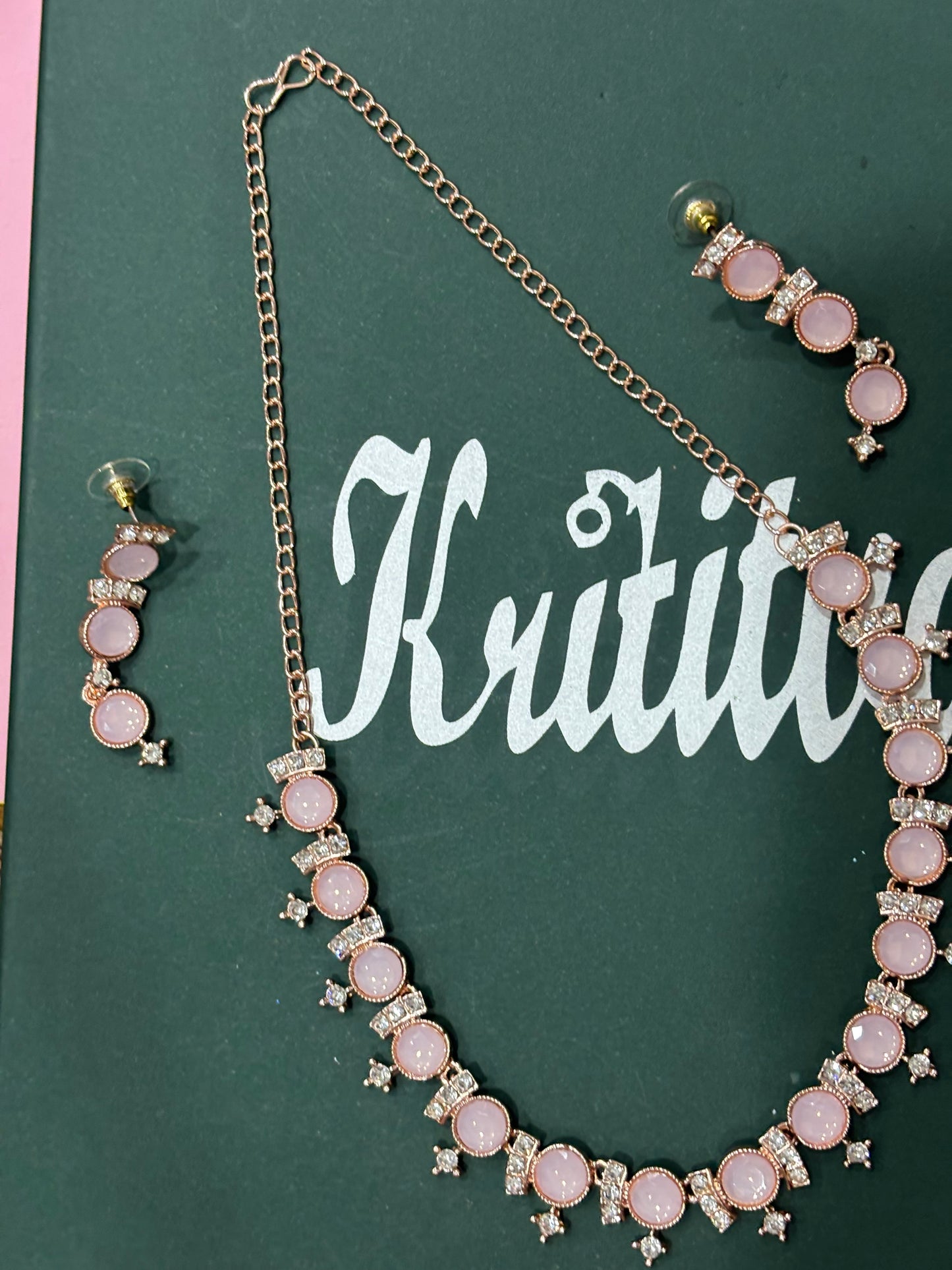 CHARMING ROSEGOLD NECKLACE SET WITH FLAMINGO PINK STONE WORK