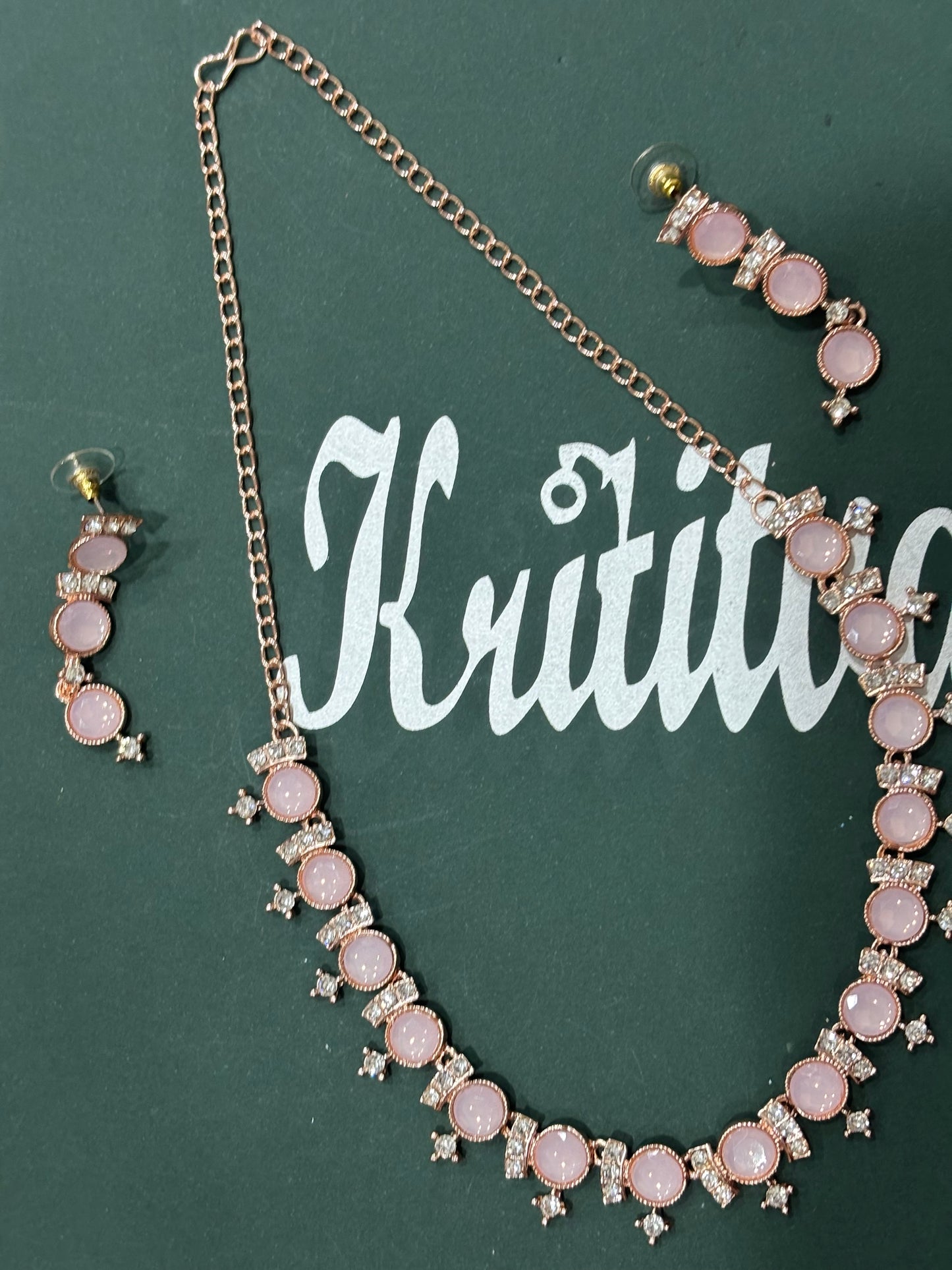 CHARMING ROSEGOLD NECKLACE SET WITH FLAMINGO PINK STONE WORK