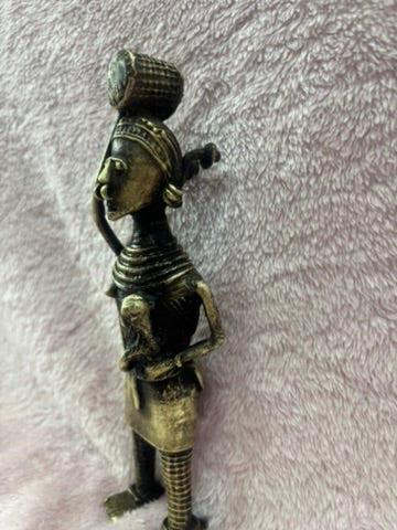 Z .ANTIQUE FORM STATUE OF A WOMEN , GOODS ON HEAD AND KID ON HAND