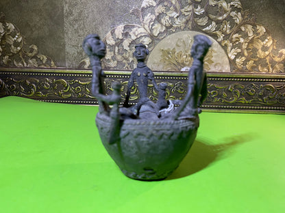 Z .ANTIQUE FORM STATUE OF 3 MEN SITTING ON A POT