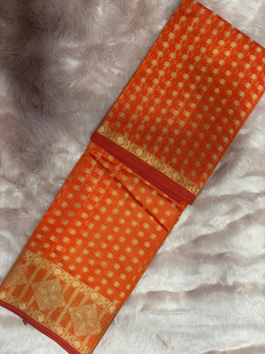 ORANGE SAREE FILLED WITH SMALL GOLDEN BOOTIES IN WHOLE SAREE