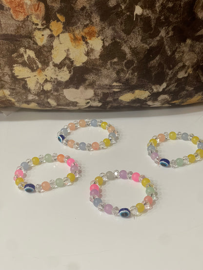 BEAUTIFUL BEADS BRACELET IN MULTI PASTEL COLOUR WITH EVIL EYE BEAD.
