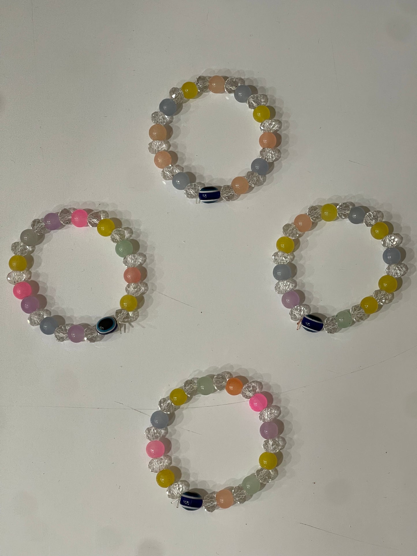 BEAUTIFUL BEADS BRACELET IN MULTI PASTEL COLOUR WITH EVIL EYE BEAD.