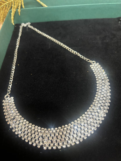 MAGNIFICENT SIVLER STONE NECKLACE IN SLEEK CHOKAR PATTERN WITH EARRING AND TIKA